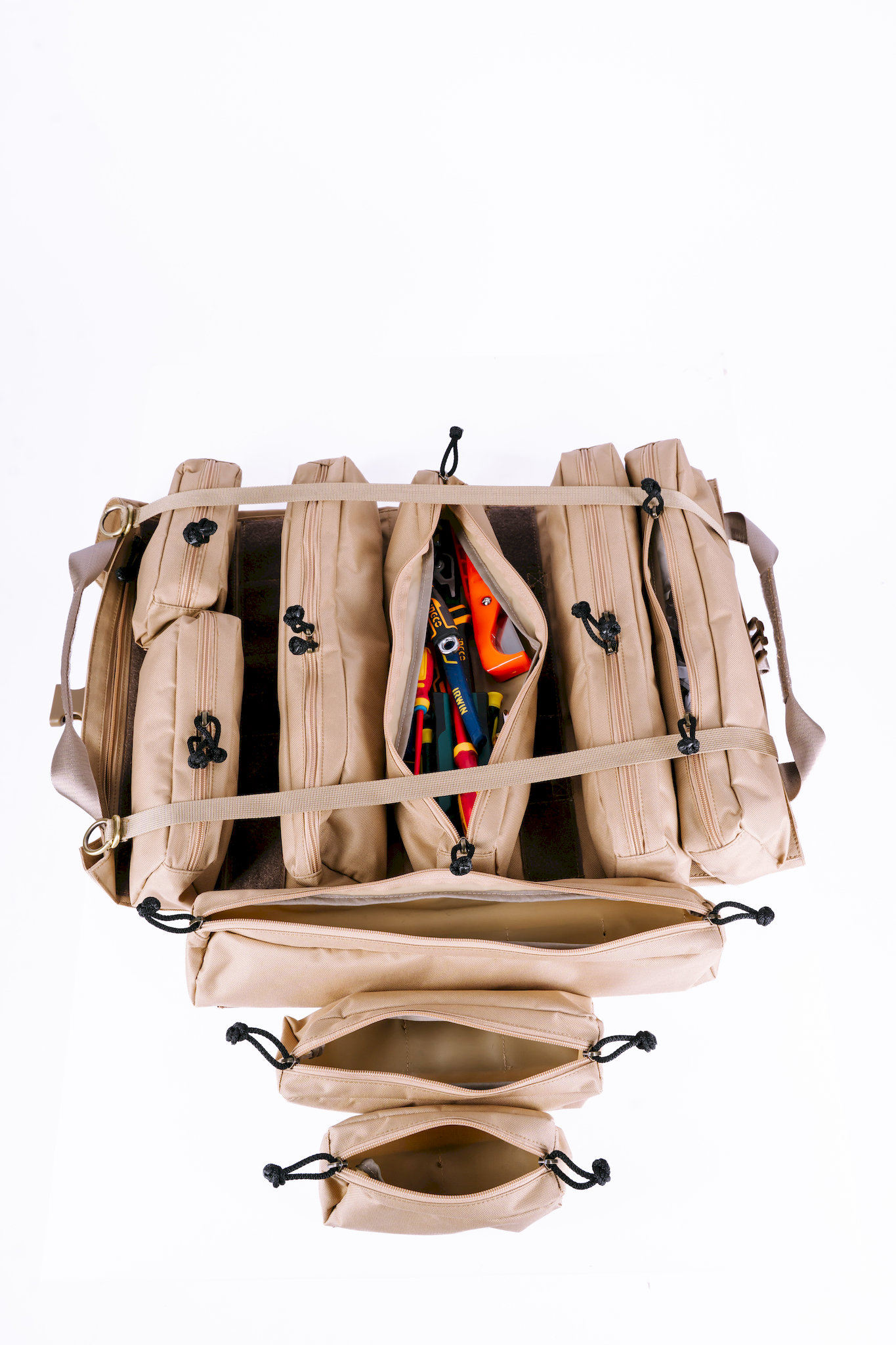 All 9 detachable tool pockets unzipped showing massive storage capacity for electrician and plumber tools