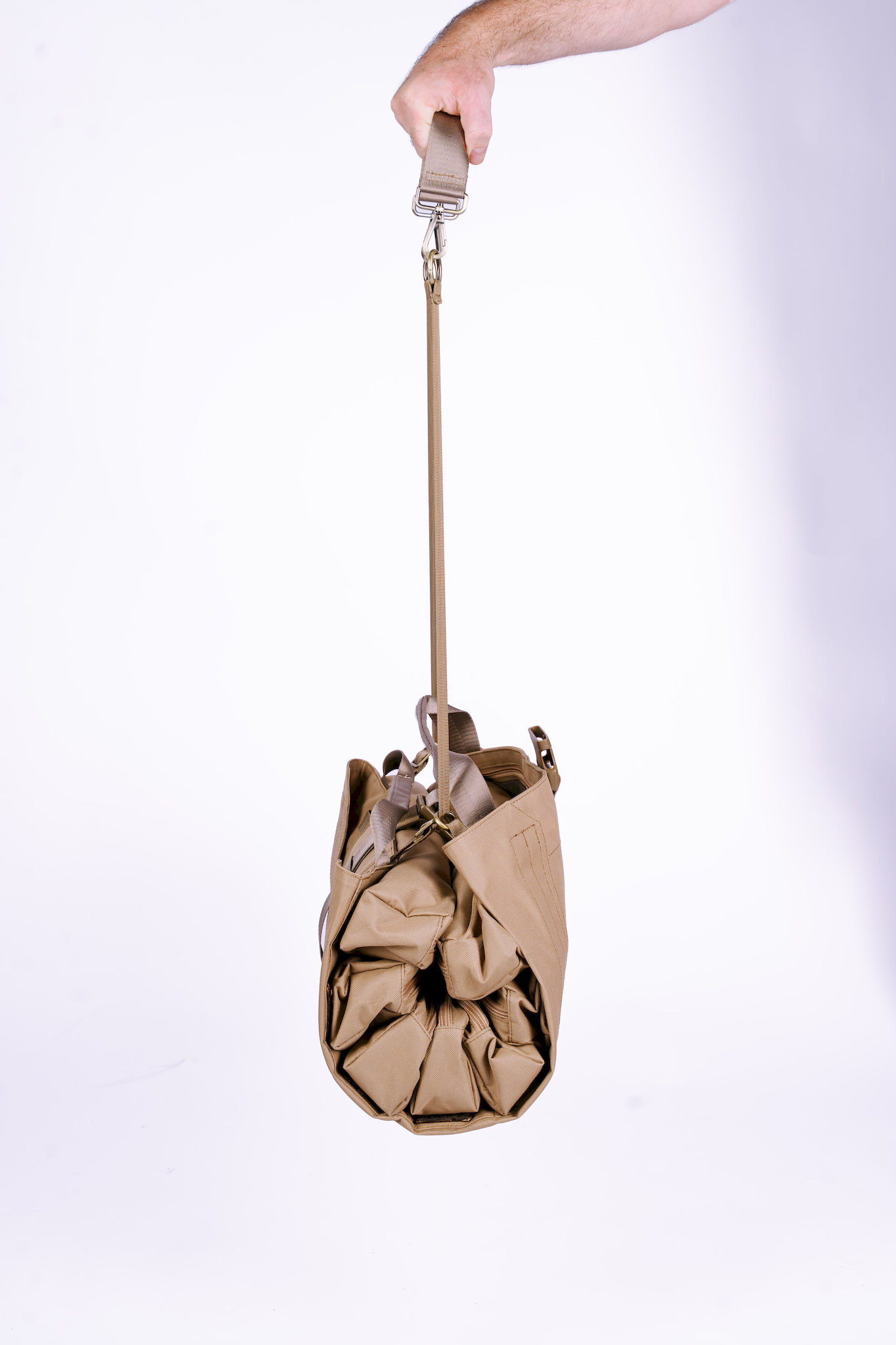Trooper Booster canvas tool bag hanging from strap — durable work bag for trade professionals