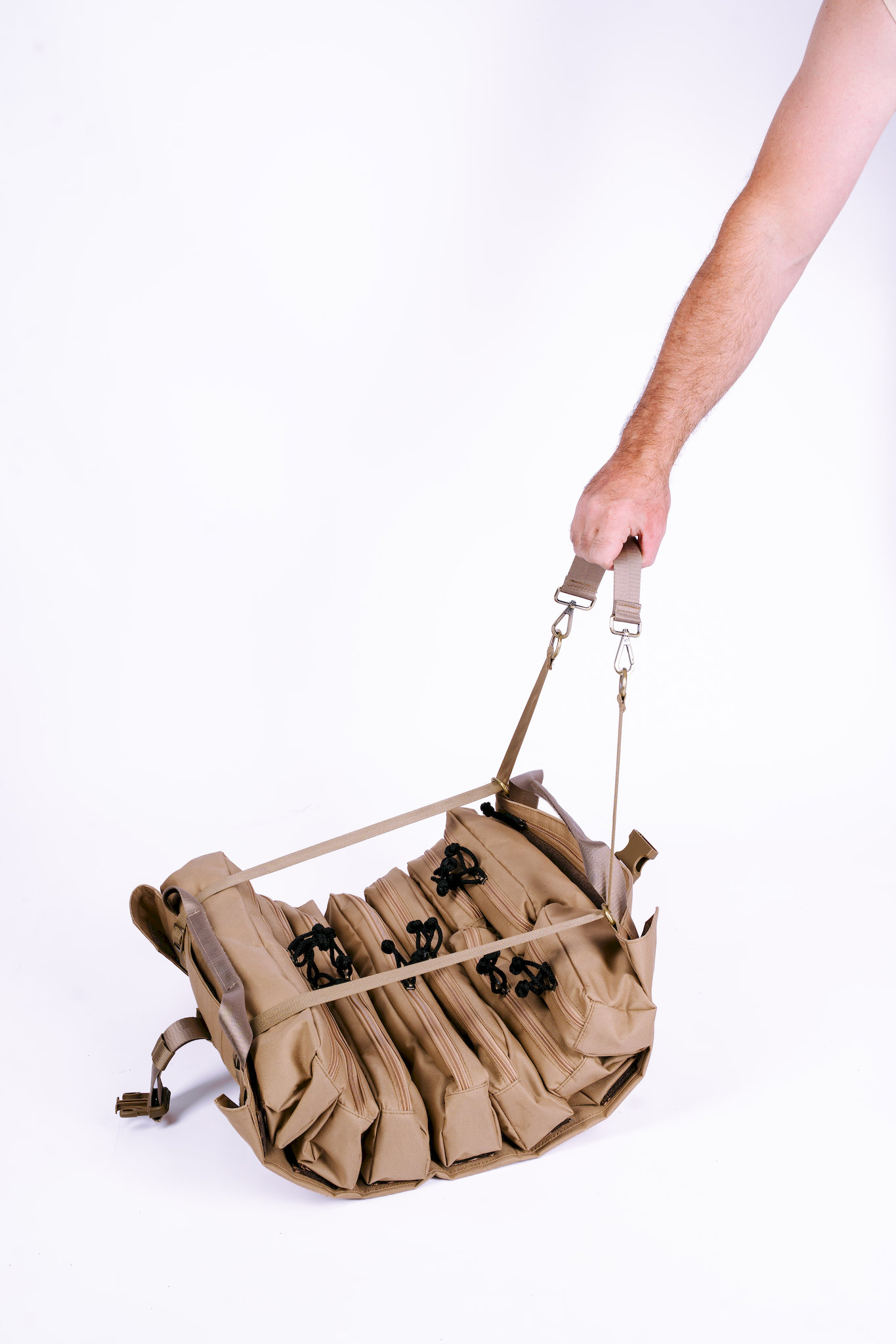 Trooper Booster heavy-duty tool bag held by carry strap showing compact 450x550mm size