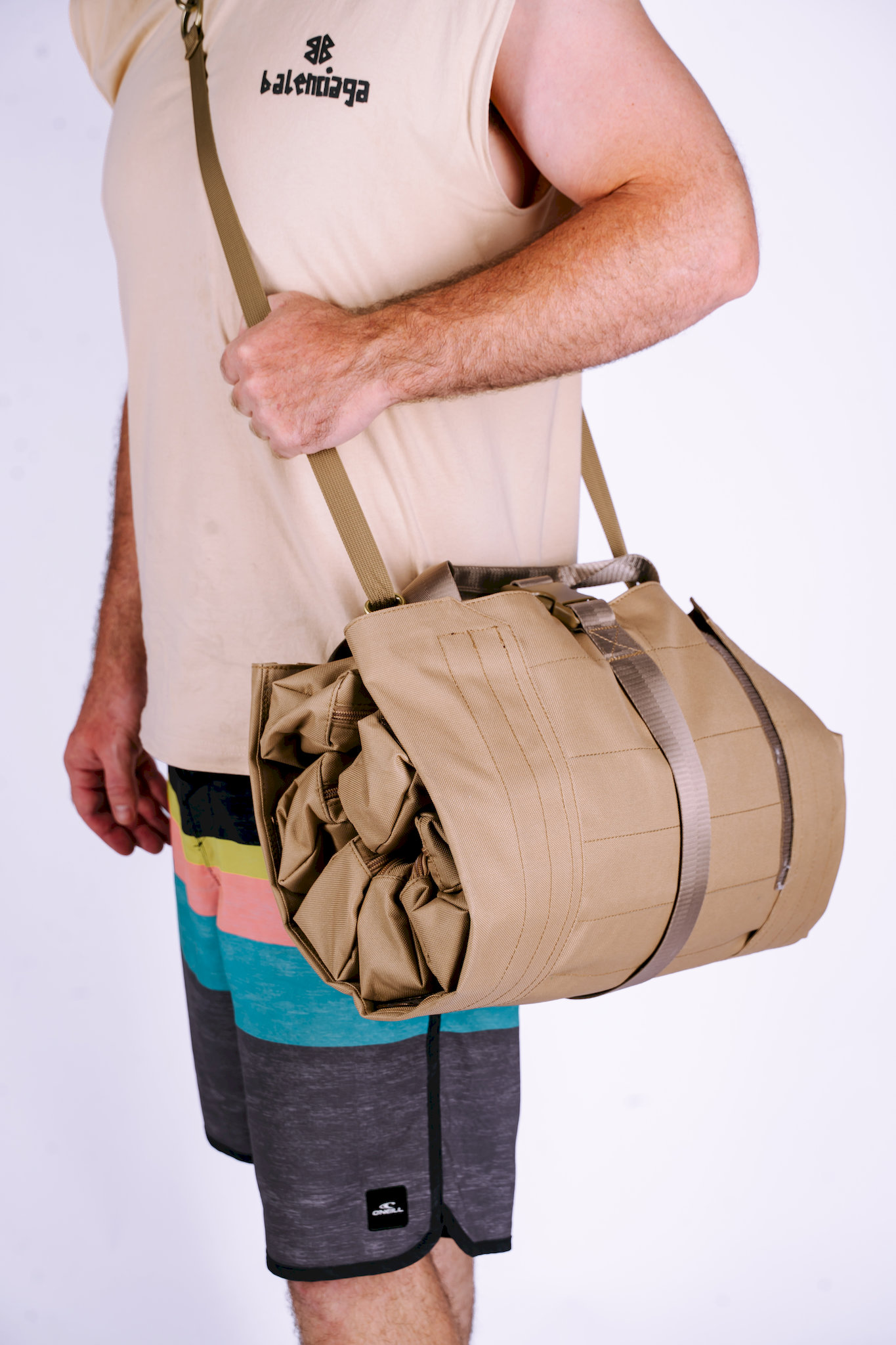 Side view of 600D canvas Trooper Booster on shoulder showing slim profile for site access